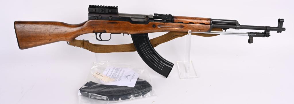 CHINESE SKS RIFLE WITH SPIKE BAYONET 7.62X39: SERIAL NUMBER 00029 BARREL 20" CALIBER 7.62X39 MANUFACTURED CHINA. Produced commercially in China for export with chrome lined bore and folding Spike bayonet. Varnished wood stocks and blue finished s