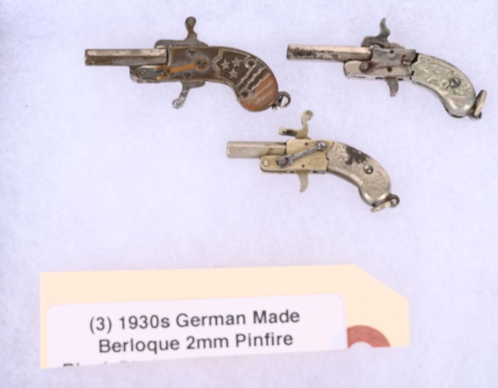 THREE 1930'S GERMAN MADE BERLOQUE 2MM PISTOLS: None are much more than an inch long. Each is working gun that shoots 2mm blanks. Condition is original. A