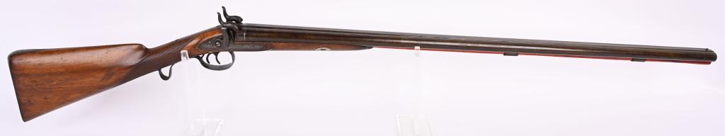 ANTIQUE EXPOSED HAMMER FRONT LOADING SHOTGUN: BARRELS 37. GAUGE 12. Early twist steel browned barrels, exposed hammers, double triggers, engraved side plates, hammers, trigger guard and tang. English style checkered walnut stock. Silver bands at 