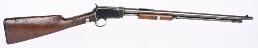 WINCHESTER MODEL 1906 SLIDE ACTION RIFLE: SERIAL 264363. BARREL 20". CALIBER .22 RF. MADE IN 1911. Features round barrel, tube magazine, sporting sights, take down, blue finish, walnut stocks, Winchester gutta percha butt plate. Condition. Ba