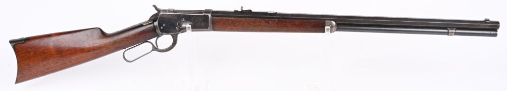WINCHESTER MODEL 1892 LEVER ACTION RIFLE: SERIAL 245980. BARREL 24". CALIBER 38-40. MADE IN 1903. Standard rifle features full octagon barrel, full magazine, semi buckhorn rear sight, dove tail front sight, blue finish, walnut stocks with rif