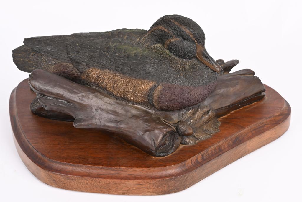 151/500 DUCKS UNLIMITED BRONZE MALLARD: Piece is dated 84. Artist is James Killen. Displays resting Mallard, infused color, walnut base. Bronze measures 13" in length and 6.5" tall not counting base. Near mint.