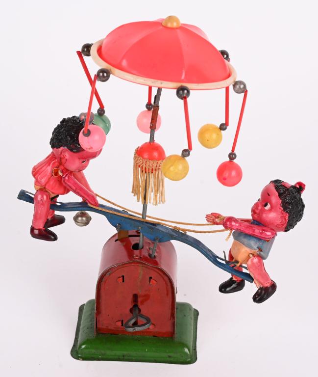 JAPAN CELLULOID WINDUP BLACK KIDS ON SEE SAW (1 of 4)