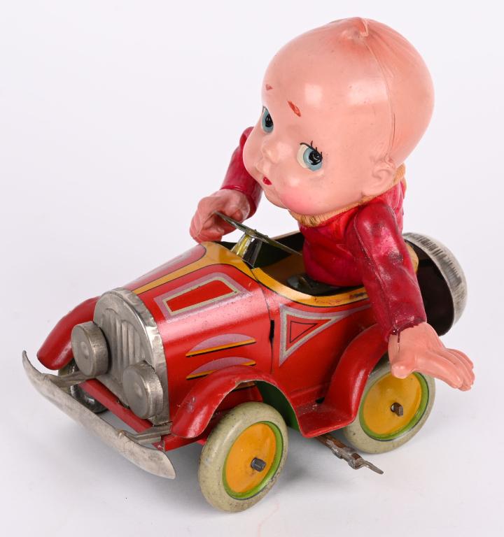 JAPAN TIN & CELLULOID WINDUP BOY IN AUTOMOBILE (1 of 7)