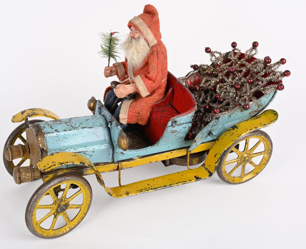 CONVERSE CLOCKWORK TOURING AUTO w/ SANTA CLAUS: Wonderful original Converse clockwork Touring Automobile with early composition Santa Claus Driver. Very nice original paint converse car that is all complete with very nice patina. A German compositi