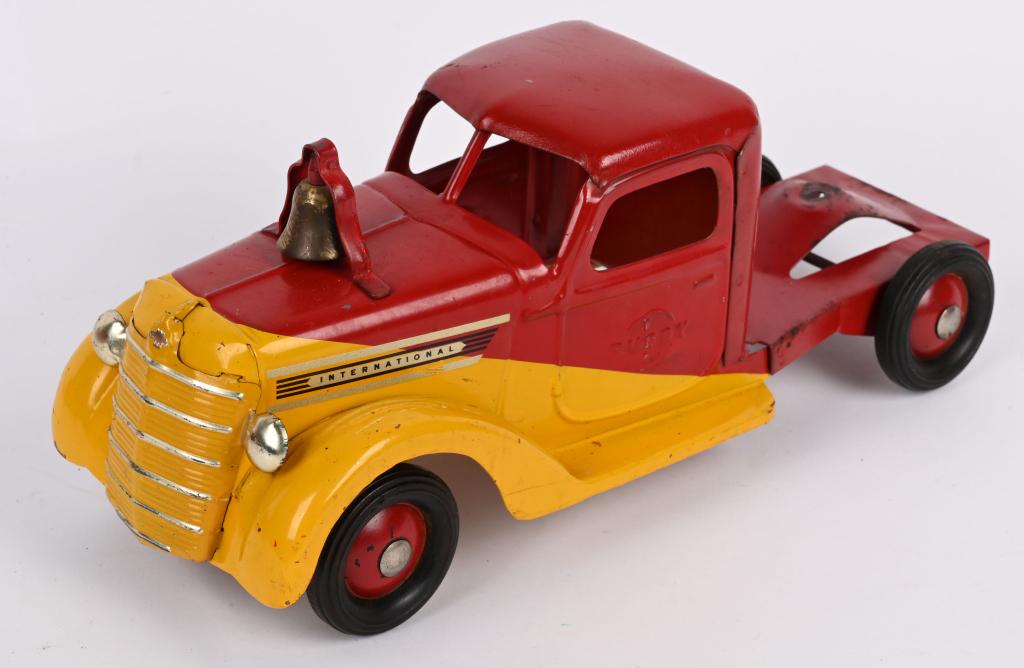 BUDDY L PRESSED STEEL INTERNATIONAL FRONT CAB: Buddy L pressed steel International Front Cab. Original red and yellow slant paint. Has nice decals. With the bell on the hood this cab would have been used on the Fire Ladder Truck. 15" Excellent