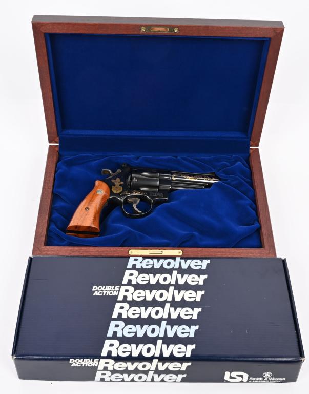 1985 ELMER KIETH TRIBUTE S&W MODEL 29-3 REVOLVER: SERIAL NUMBER EMK1671. BARREL 4". CALIBER .44 MAGNUM. MADE 1985. Blue with adjustable rear sight, red insert front sight, wide spur case color hammer, case color trigger, smooth grips with medallion. 