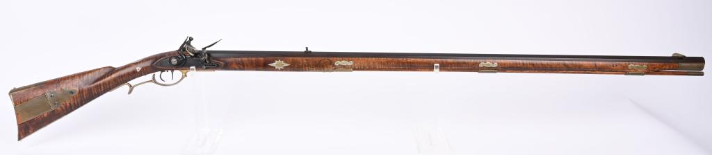 QUALITY CUSTOM FULL LENGTH FLINTLOCK KY RIFLE: BARREL 42". CALIBER 50. NOT SIGNED. Features dull blue full length octagon barrel, full length curly maple stock, double triggers, brass furniture with iron hardware. Stock is carved and incised. Left
