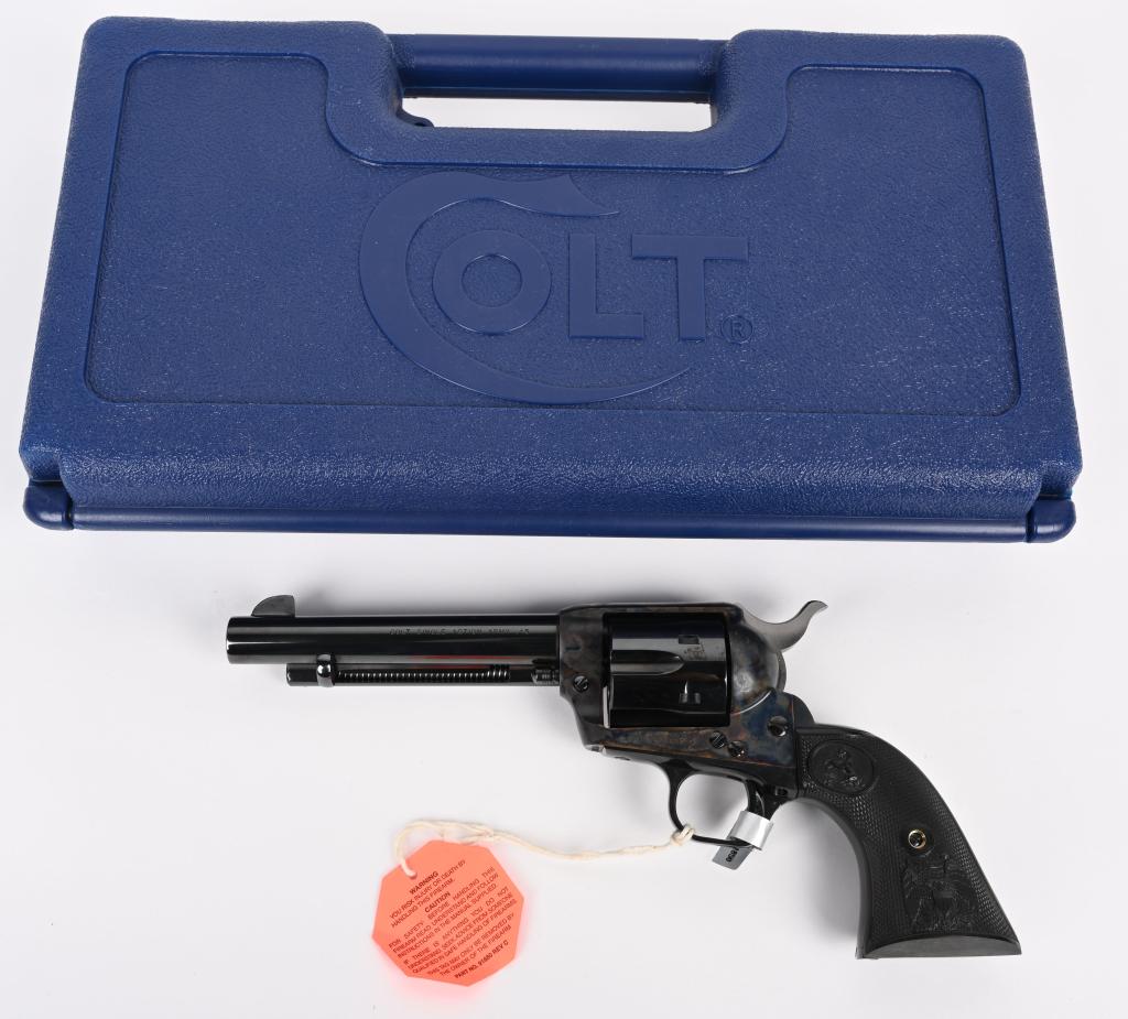 MIB COLT SAA REVOLVER: SERIAL NUMBER S88247A. BARREL 5.5". CALIBER 45 COLT. Unfired in original blue box with paperwork, hang tag and original scan ring on trigger guard. Standard blue and case color with eagle grips. Condi
