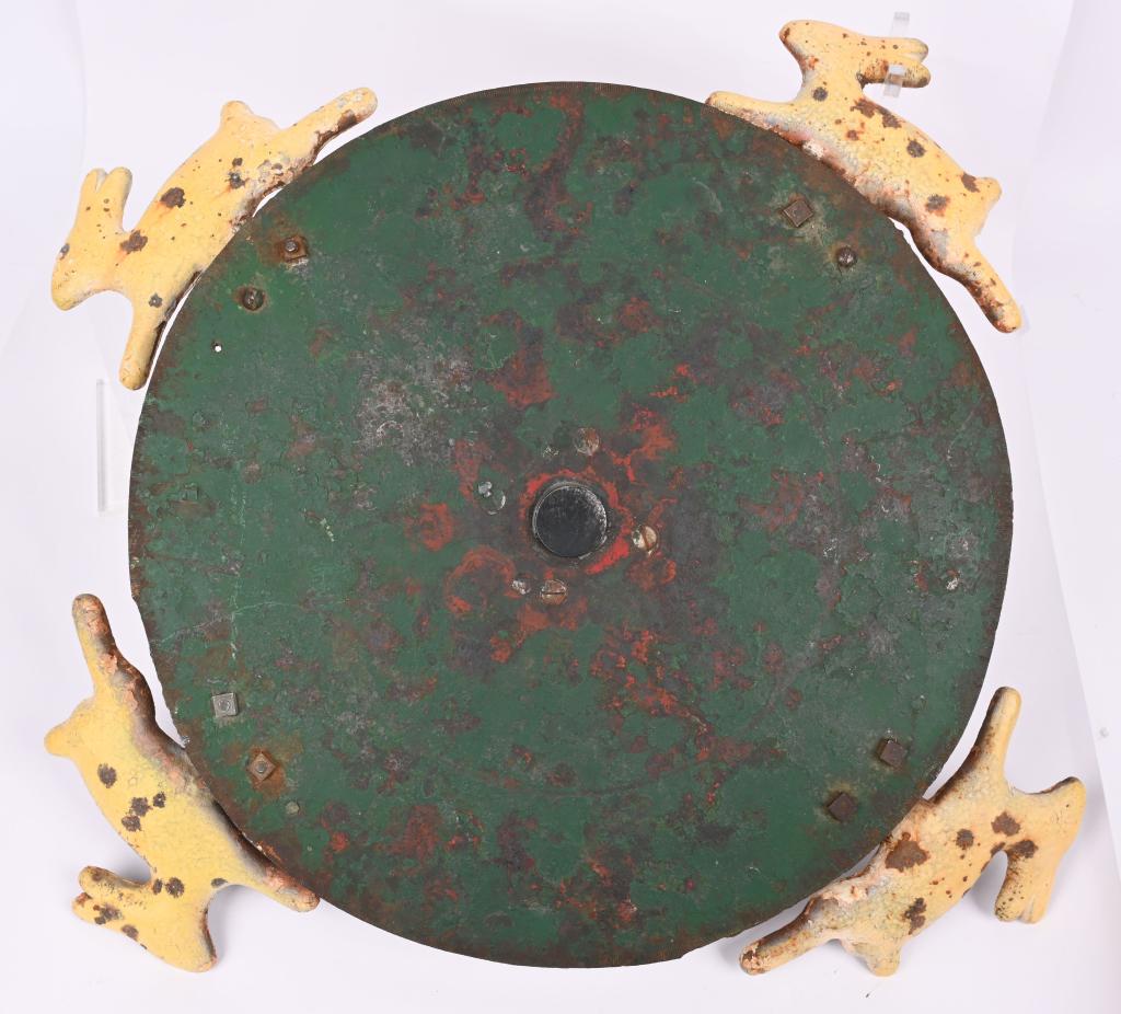 LG. STEEL 19TH CENT. KNOCK DOWN ARCADE TARGET: Solid 1/2" steel disc that measures 18" with original green paint and four knock down white rabbits that measure 8x6". These were used at the early arcade shooting galleries at the turn of the century
