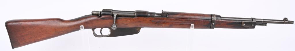ITALIAN MODEL 38 6.56 CARCANO CARBINE DATED 1940: SERIAL NUMBER AE7028 BARREL 21-1/2" CALIBER 6.5 CARCANO MANUFACTURED 1940. Produced at Terni with walnut finger groove stock with handguard. Lug for attaching folding knife bayonet Fixed rear sight ma
