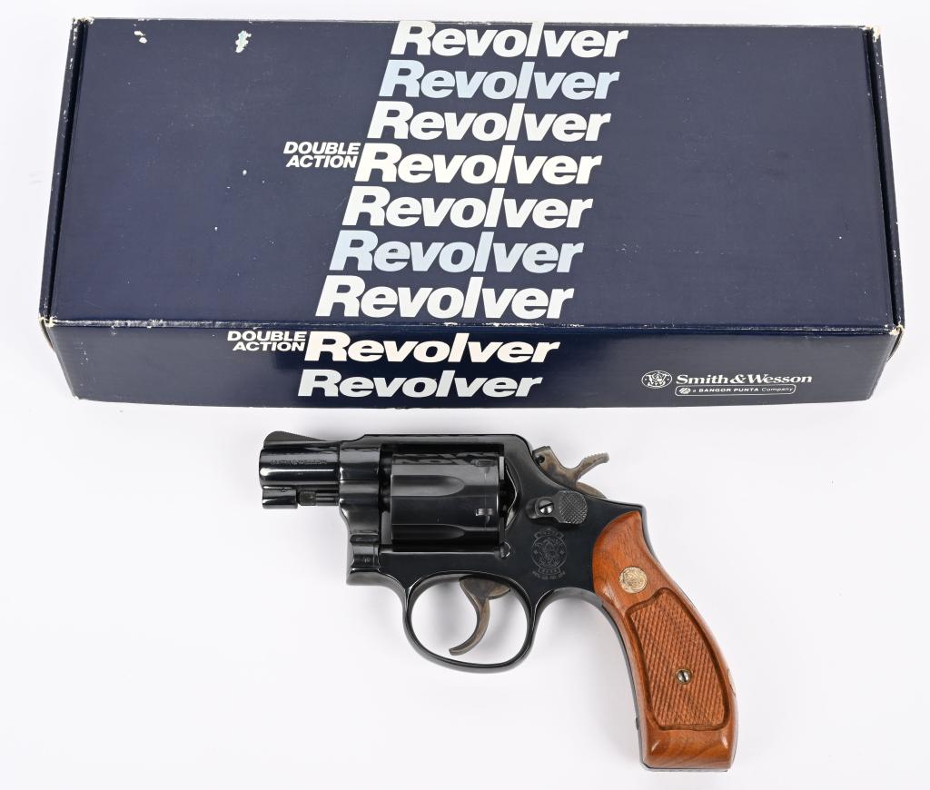 BOXED S & W MODEL 10 -7 REVOLVER (PERU DETECTIVE): SERIAL NUMBER AEW7402. BARREL 2". CALIBER .38 SPECIAL.. Right side of frame is stamped " POLICIA DE INVESTIGACIONES DEL PERU". All other features are standard to include 3-screw, round butt K-frame, b