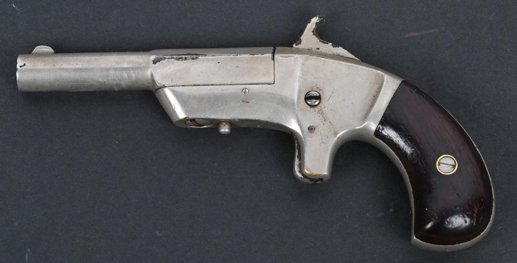 RARE COWLES & SON SINGLE SHOT PISTOL: SERIAL NUMBER 3919. BARREL 3 1/4". CALIBER 30 RF. MADE IN 1865, CHICOPEE MASS. Very low production estimated as several hundred only. Features nickel finish with spur trigger, rosewood bird head grips