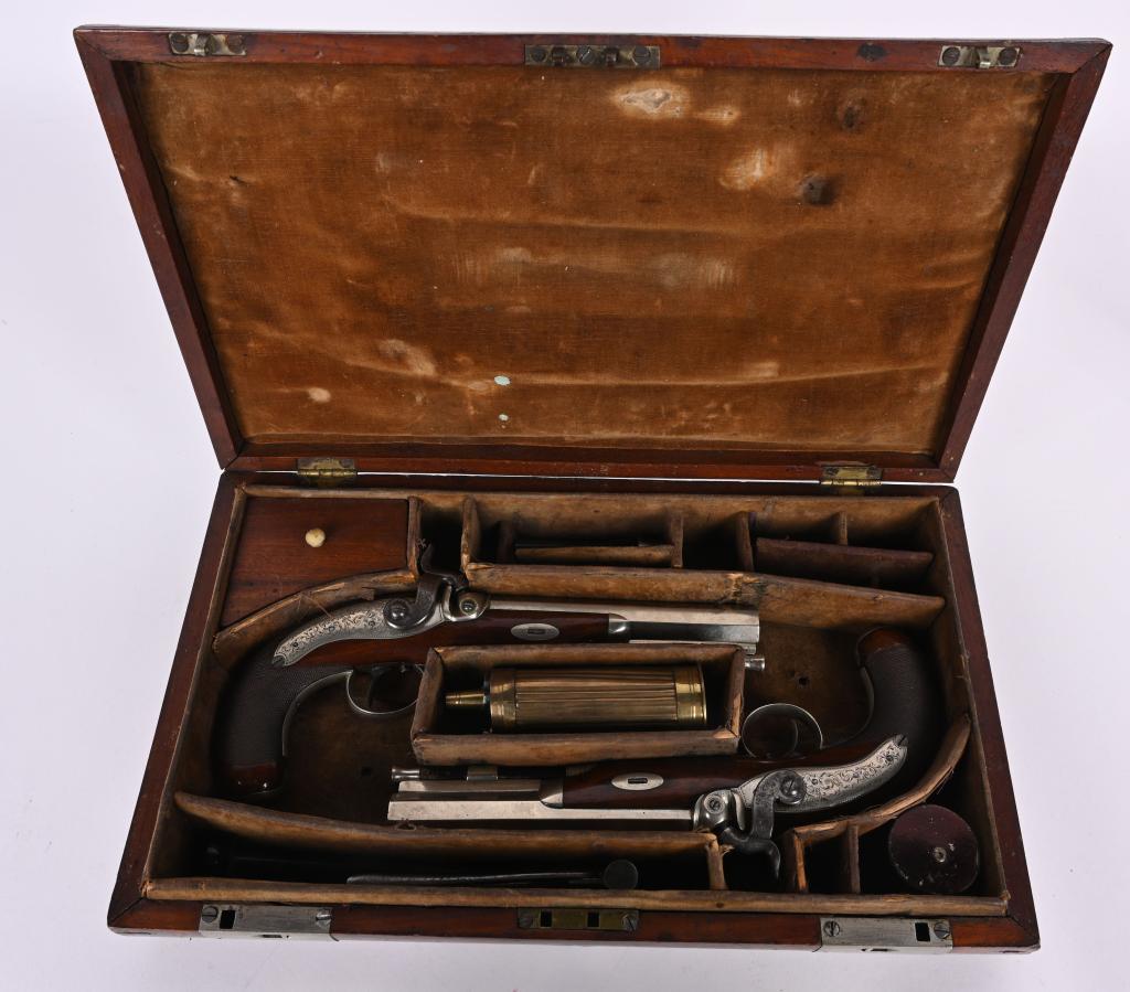 CASED ENGLISH GENTLEMANS PISTOLS BY MILLER: SERIAL NUMBER N/A BARREL 6" CALIBER 44 SMOOTHBORE MANUFACTURED CIRCA 1850'S. English made by Andrew Miller with London proofs. Built in the classic American style to emulate the Henry Derringer belt p