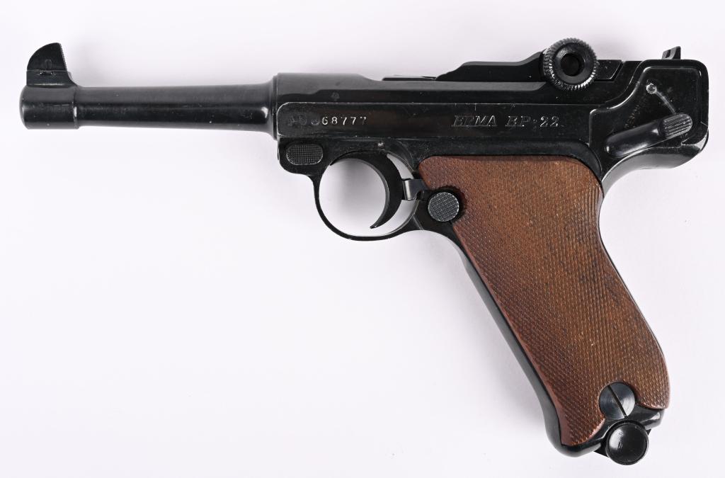 ERMA GERMAN .22 LUGER SEMI AUTO PISTOL: SERIAL 68777. BARREL 4.5". CALIBER .22 LONG RIFLE. In the 1960-1970’s Erma realized the potential of new production Luger’s in the market. Therefore designed and produced the LA-22, a Luger clone 
