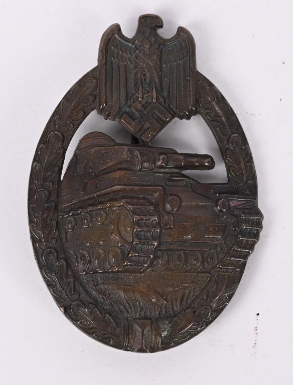 WWII NAZI GERMAN PANZER ASSAULT BADGE BRONZE WW2: Nicely detailed, die stamped, hollow backed, tombac award with a bronze washed finish is in the form of an embossed, vertically oval oak-leaf wreath with a Wehrmacht style eagle with down-swept wings,