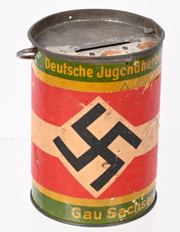 WWII NAZI GERMAN HJ WHW DONATION CAN WW2: A Green and yellow, sheet metal can, roughly 17cm in overall height, and 10.5cm in diameter. To the exterior a paper Hitler Youth insignia with a district stamp. The front is also named to "Gau Sachse