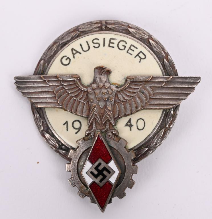 HJ/DAF GAU LEVEL NATIONAL TRADE COMPETITION BADGE: Nice quality, multi-piece, silver washed, die struck tombac construction Kreis level badge with multi-colored enamel work. Badge is in the form of a 40mm diameter, circular base with recessed outer ed
