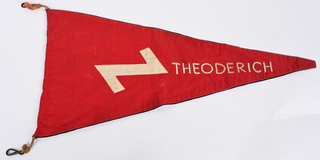 WWII NAZI GERMAN HITLER YOUTH FLAG W WOLF'S TOOTH: Third-Reich DJ pennant. 10 1/2" x 21" is double sided with the obverse having a red field with a white wolf's tooth and white embroidered honorarium "THEODERICH" (King of the Ostergoths). The reverse 
