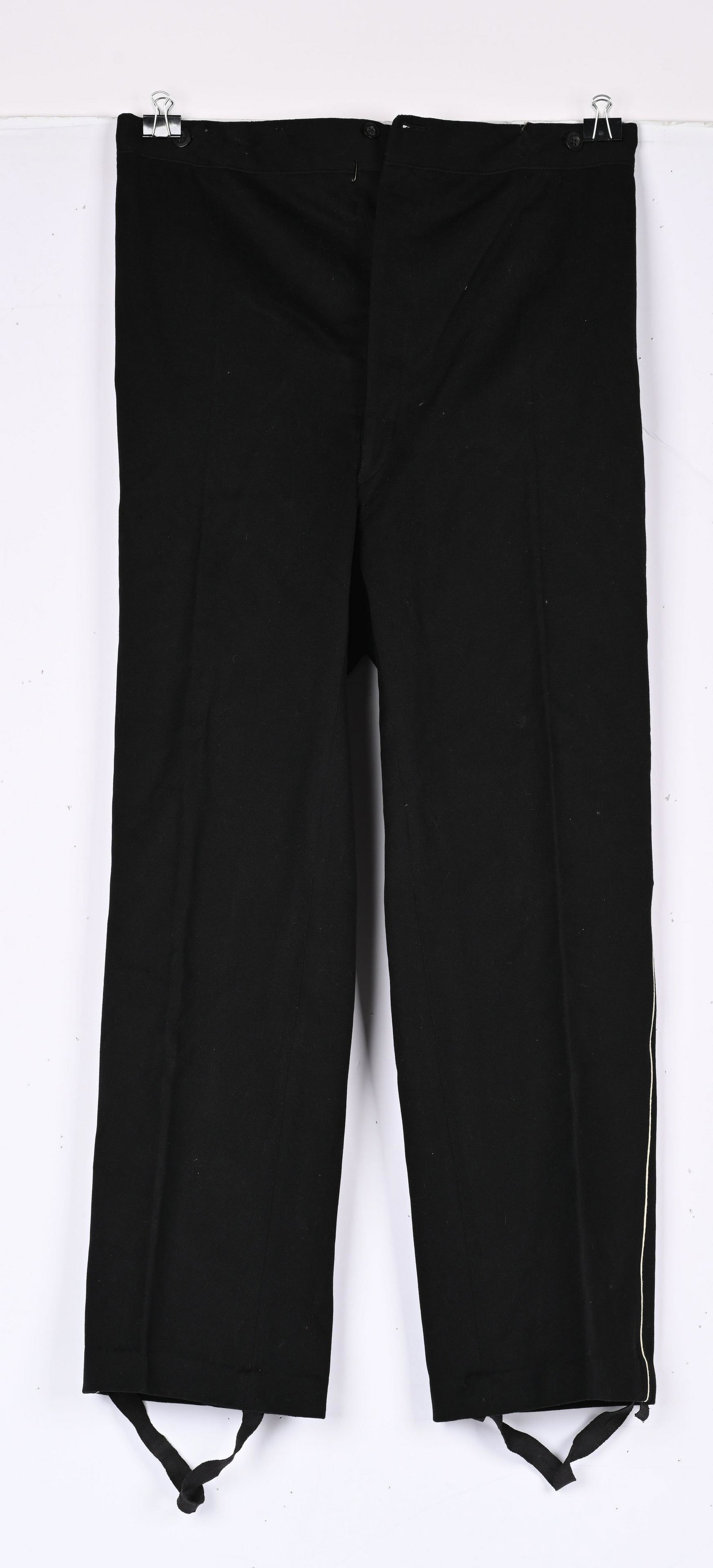WWII NAZI GERMAN SS BLACK SERVICE UNIFORM TROUSERS: Very nice quality black wool construction straight legged, long pants. The pants feature a vertical four button French fly with an additional button at the waistband. The pants have two, diagonally an