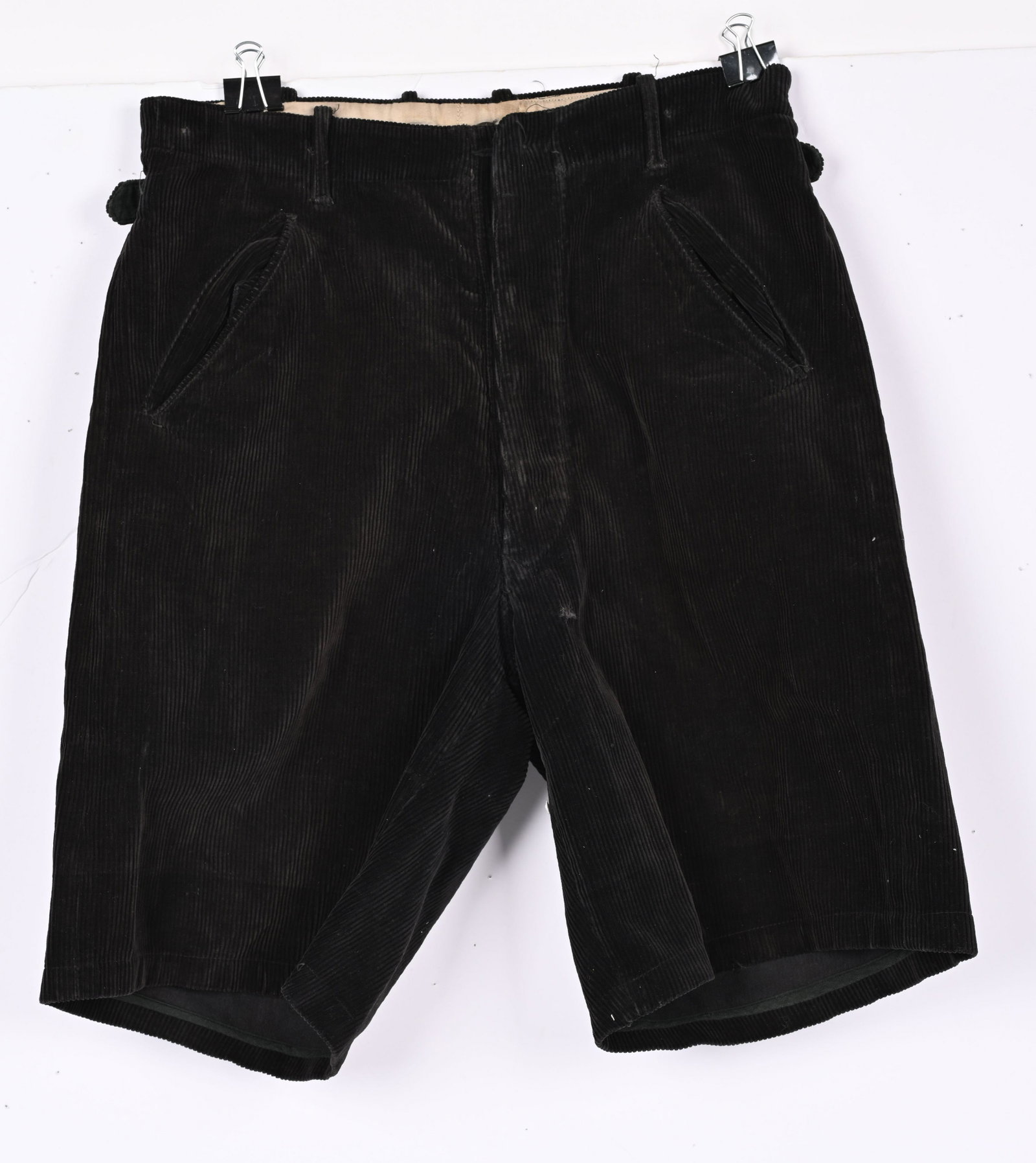 WWII NAZI GERMAN HITLER YOUTH HJ DJ SHORTS WW2: Black corduroy shorts, introduced in 1935, which feature a three button French fly, with an additional button and buttonhole at the waist, diagonal slash hip pockets, two horizontal slash pockets and 