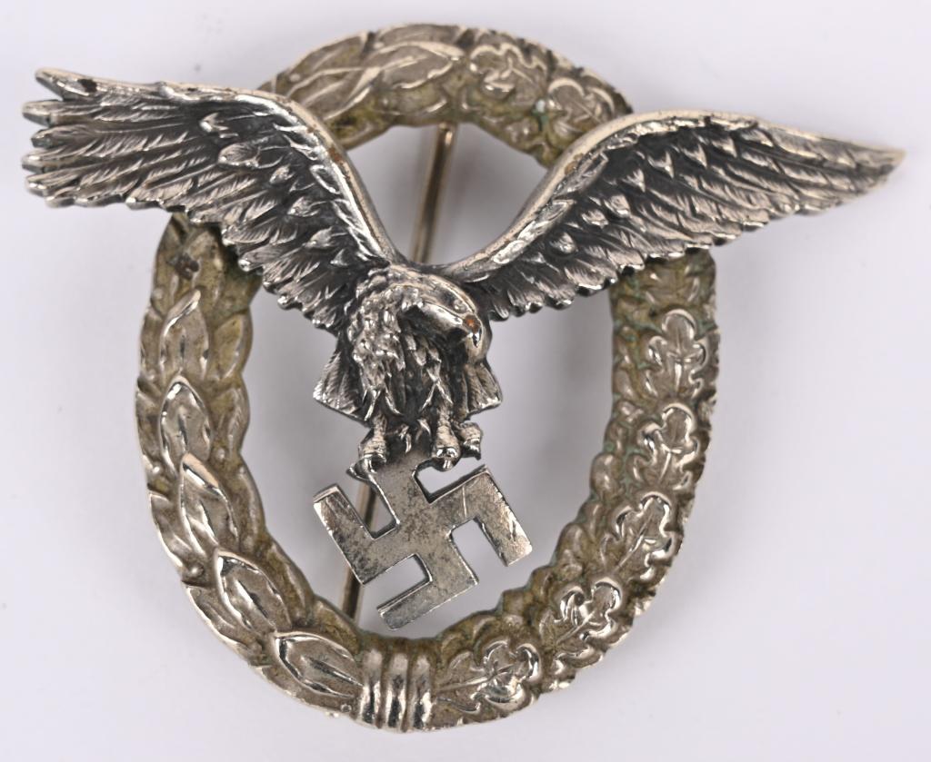 WWII NAZI GERMAN LUFTWAFFE PILOT BADGE WW2: An Early Pilot's Badge by C.E. Juncker with Case - Badge in silvered tombac, marked on reverse "C.E.JUNCKER BERLIN SW". Very good early quality with good details, nice original patina, in very fine co