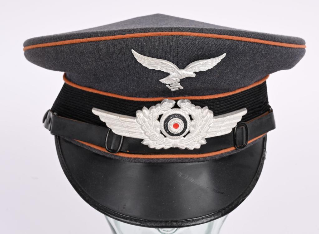 WWII NAZI GERMAN LUFTWAFFE SIGNAL NCO VISOR CAP: Nice quality, privately purchased, Luftwaffe blue/gray, wool/rayon blend construction flight EM/NCO's visor cap features a black, horizontally ribbed, interwoven, mohair centerband, and golden brown w
