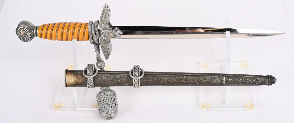 WWII NAZI GERMAN LUFTWAFFE DAGGER PAUL WEYERSBERG: Approximately 29cm long bright nickel/silver plated double edged and drop forged steel stiletto style blade with a flat central plane. Maker marked to Paul Weyersberg The leather washer is still intac