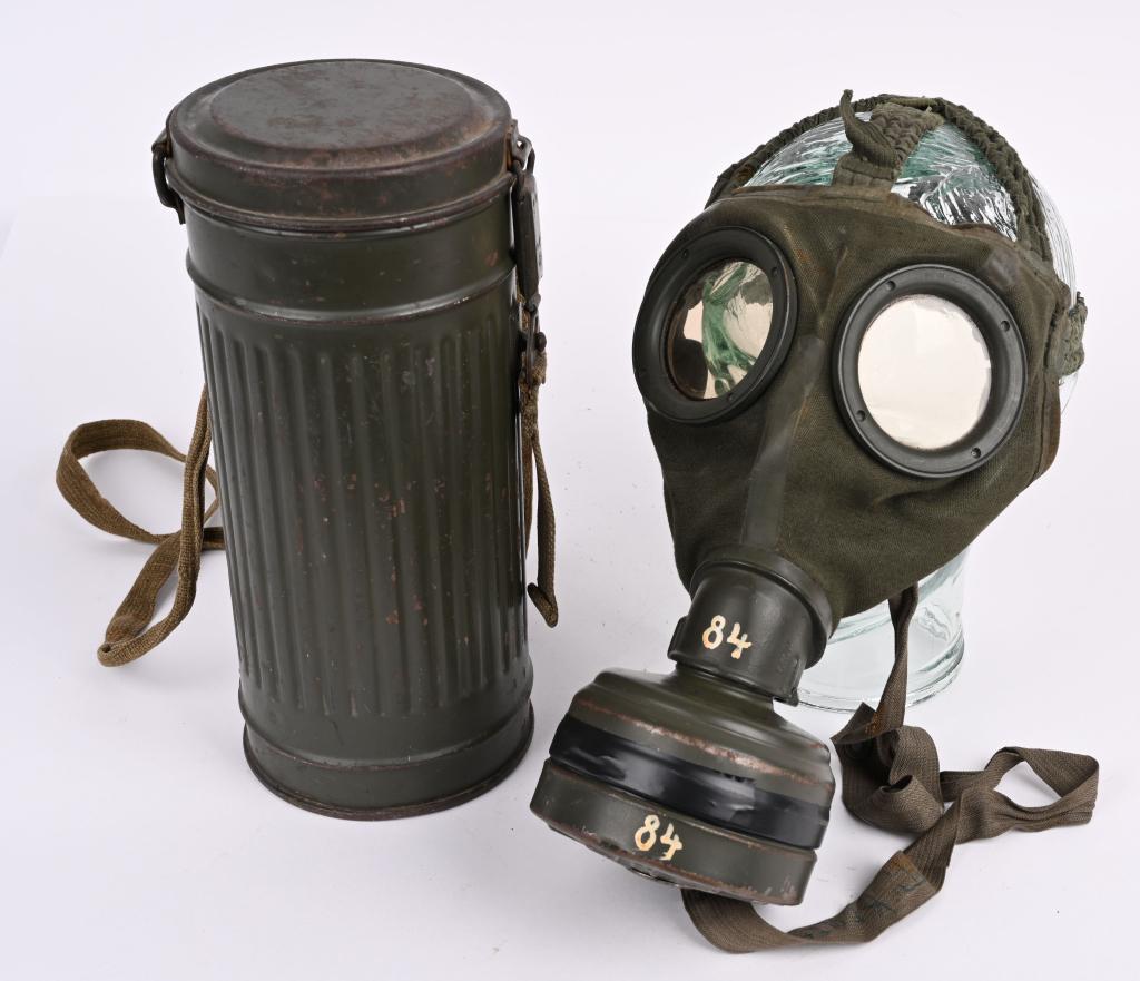 WWII NAZI GERMAN WEHRMACHT M30 GASMASK & CANISTER: M30 pattern cloth covered, rubberized canvas gas mask. Mask is complete with all straps. Mask is size marked 1. Included is a "F" 39 dated filter. The mask comes housed in a second pattern M30/38 corr