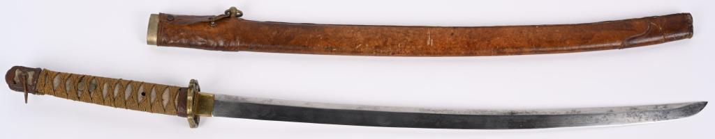JAPANESE SHIN GUNTO KATANA SWORD, w/ SAYA: Shin Gunto Katana with a 33 1/4" blade with a 26" cutting edge. Blade is bright with no visible hamon. Blade surface has scattered light rubs and scratches. Habaki is brass. Sword has Shin Gunto mount