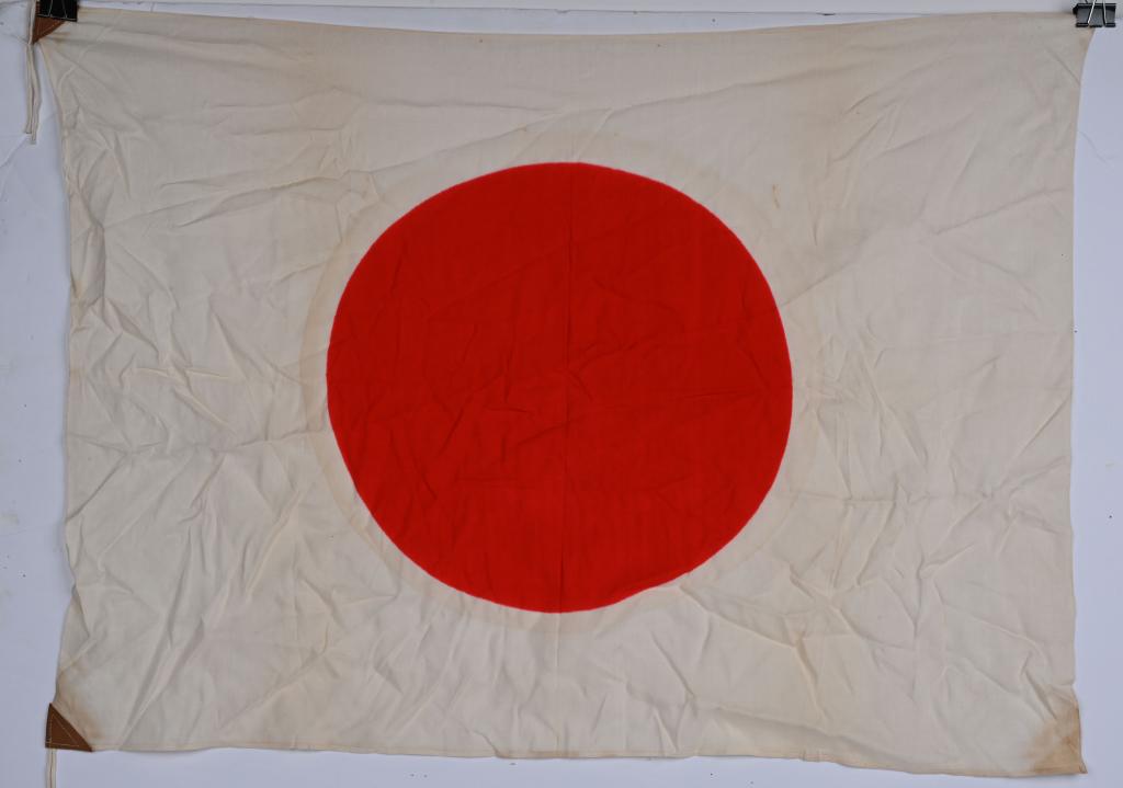 WWII JAPANESE LARGE NATIONAL FLAG WITH TIES WW2: A silk Japanese National flag is a printed flag measuring approximately 25 x 36. Nice untouched example.