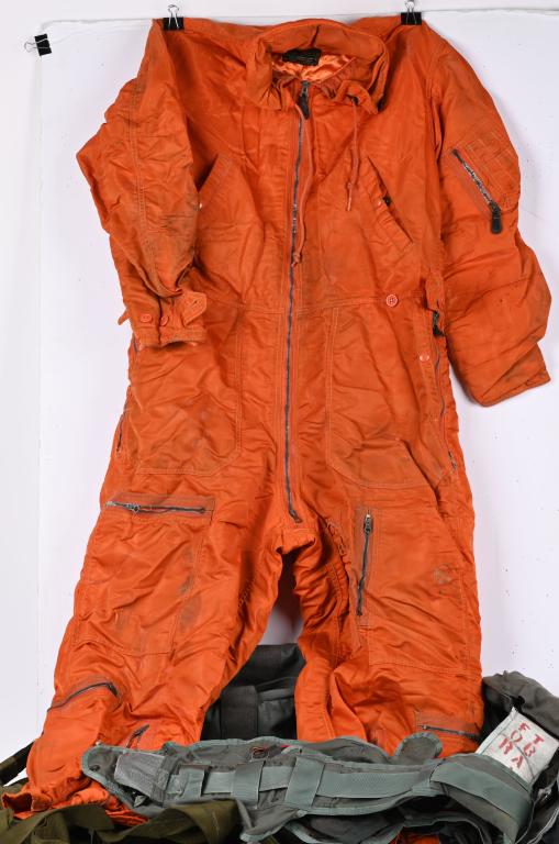 AVIATION GEAR LOT PARACHUTE HARNESS LIFE VEST ECT: Lot of Aviation Flight gear to include 1) Coverall Flying Mens size Large Regular Orange Flight Suit by Olive Hill Manufacturing Co. in excellent condition. 2) US Army helicopter aircrew systems life 