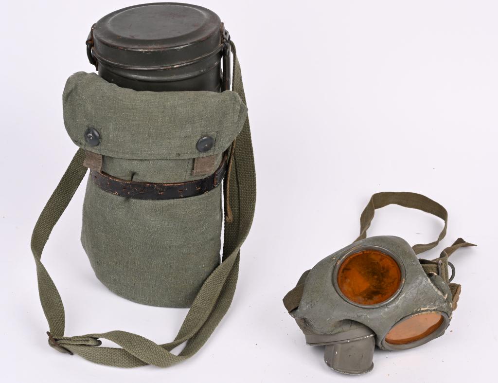 WWII NAZI GERMAN M30 GASMASK & CANISTER GAS WW2: M30 pattern cloth covered, rubberized canvas gas mask. Mask is complete with all straps. Included is a "FE" 38 dated filter. Comes with its early, 25cm tall M30 Gasmask canister. Retains a good portio
