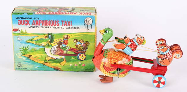 TPS TIN WINDUP DUCK AMPHIBIOUS TAXI w/ BOX: Japan tin windup Duck Amphibious Taxi. All original and complete with Duck, Money and Squirrls. Very nice colors. Windup works. With nice complete Box. 6" Excellent