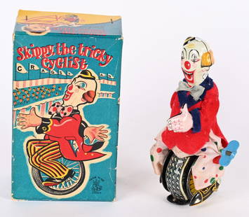 TPS TIN WINDUP SKIPPY THE TICKY CYCLIST w/ BOX: Japan tin windup Skippy The Tricky Cyclist. All original and complete Clown on Unicycle. Very nice colors. Windup works. With nice complete Box. 5 1/2" Excellent