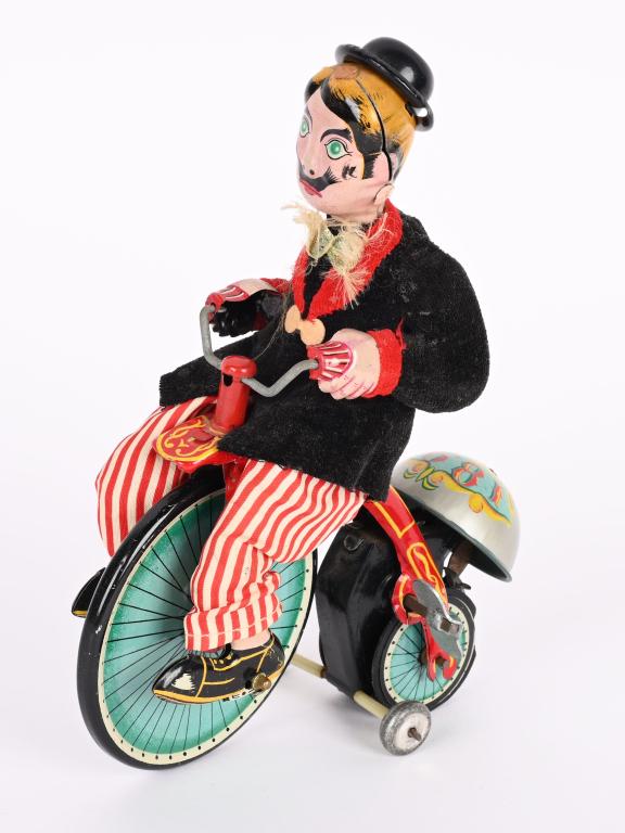 TPS TIN WINDUP GAY 90'S CYCLIST (1 of 4)