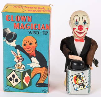 JAPAN WINDUP CLOWN MAGICIAN w/ BOX: Japan tin windup Clown Magician. All original and complete. Clown makes Rabbit disappear under his top hat. Windup and action works. Comes with nice complete Box. 7" Excellent