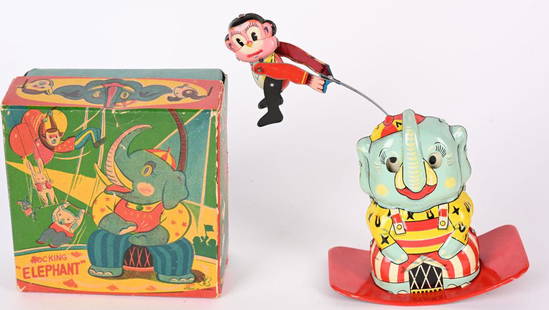 JAPAN TIN WINDUP ROCKING ELEPHANT w/ BOX: Japan tin windup Rocking Elephant. All original with Elephant and swinging Monkey. Nice colors. Windup works. Comes with complete Box. 5" Excellent