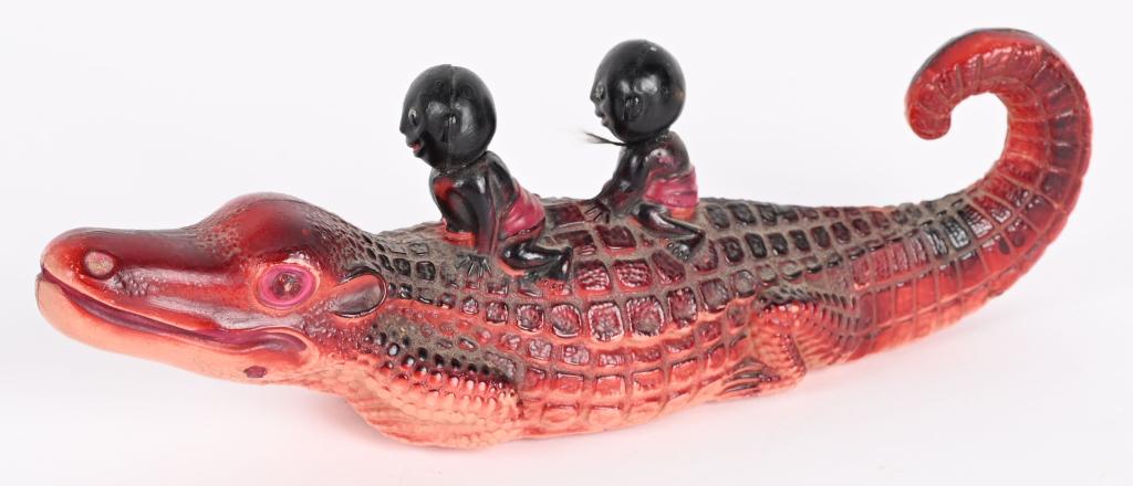 JAPAN CELLULOID NATIVES RIDING ALLIGATOR (1 of 3)