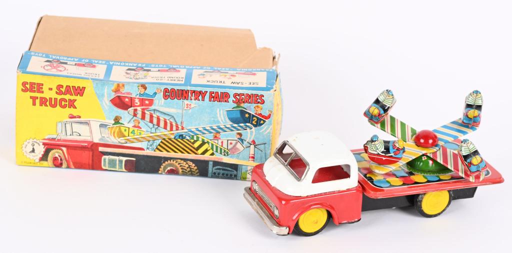 JAPAN TIN FRICTION SEE-SAW TRUCK w/ BOX: Japan tin friction See-Saw Truck. All original and complete. Nice colors. Friction works. With Box that has corner off bottom. 7 1/2" Excellent