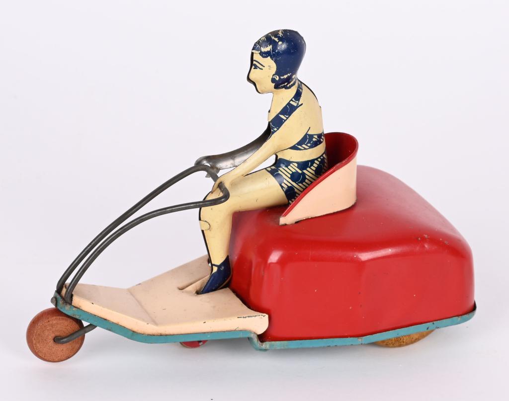 LINDSTROM TIN WINDUP LADY ON MOTOR SCOOTER (1 of 3)