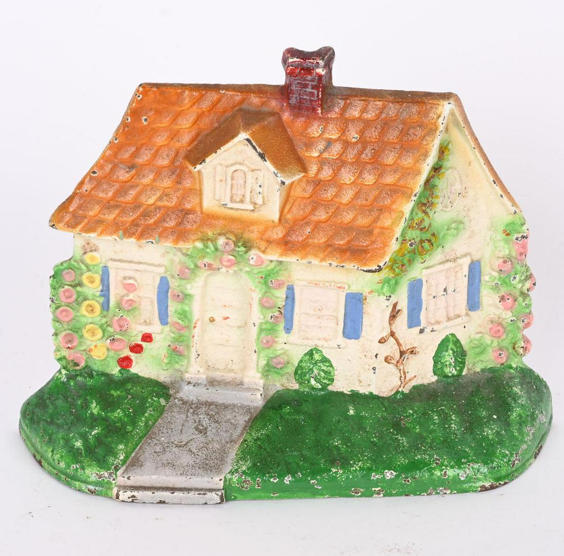 HUBLEY CAST IRON COTTAGE DOOR STOP (1 of 2)