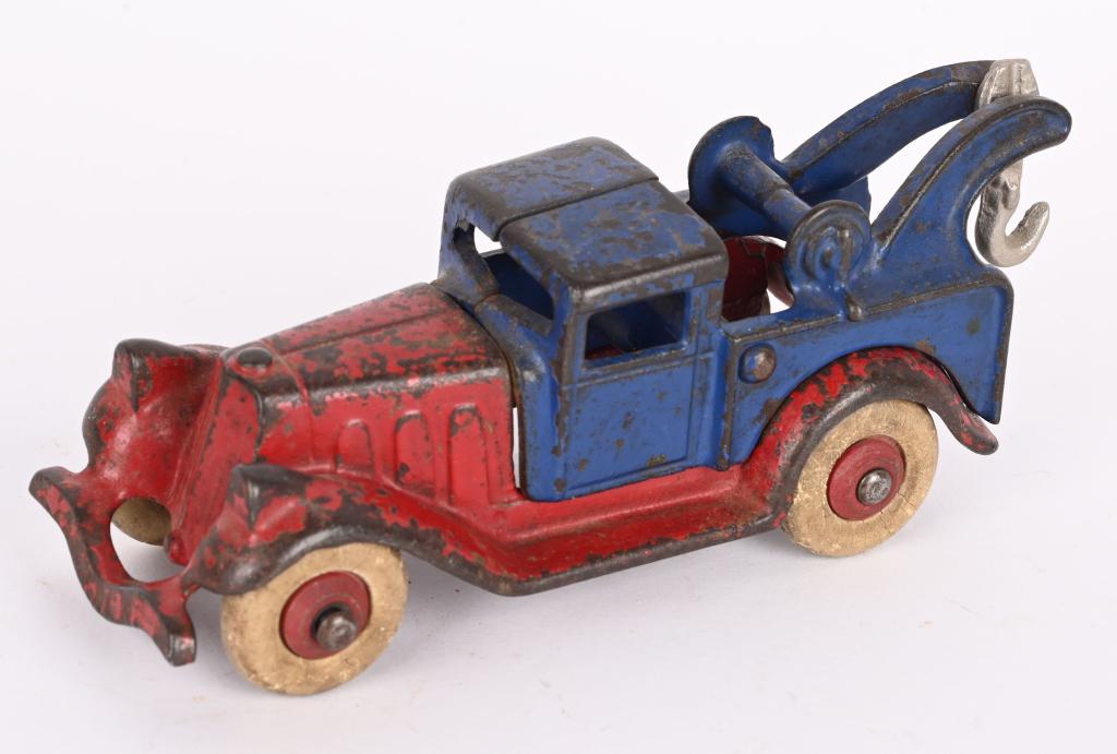 HUBELY CAST IRON TAKE-A-PART WRECKER TOW TRUCK: Large version Hubley cast iron Wrecker Tow Truck. All original paint wheels, and tires. No cracks or repairs. 6", Very Good