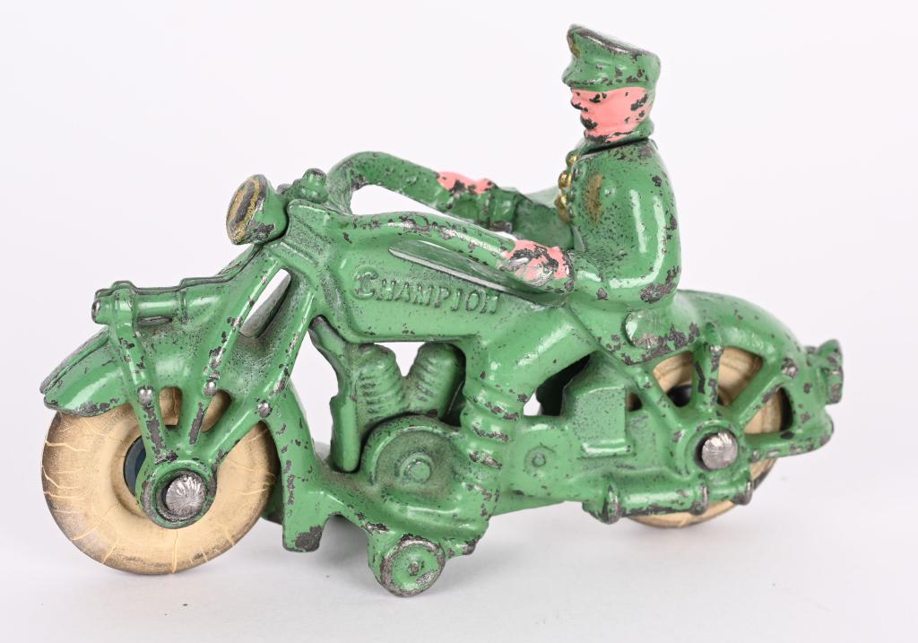 CHAMPION CAST IRON SOLO MOTORCYCLE: Small version of the Champion solo motorcycle. Nice green paint and white rubber tires. No cracks or repairs. 5", Excellent