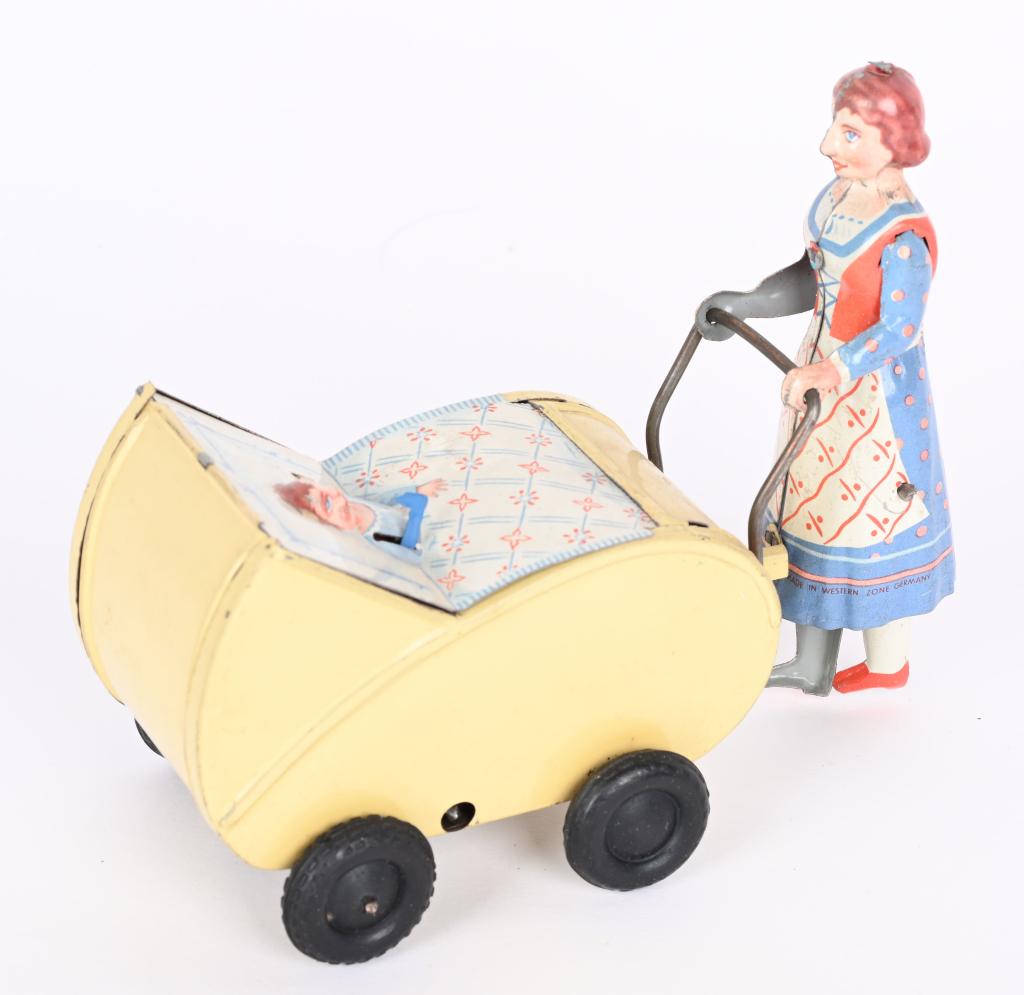 GERMAN TIN WINDUP LADY WITH BABY CARRIAGE (1 of 4)