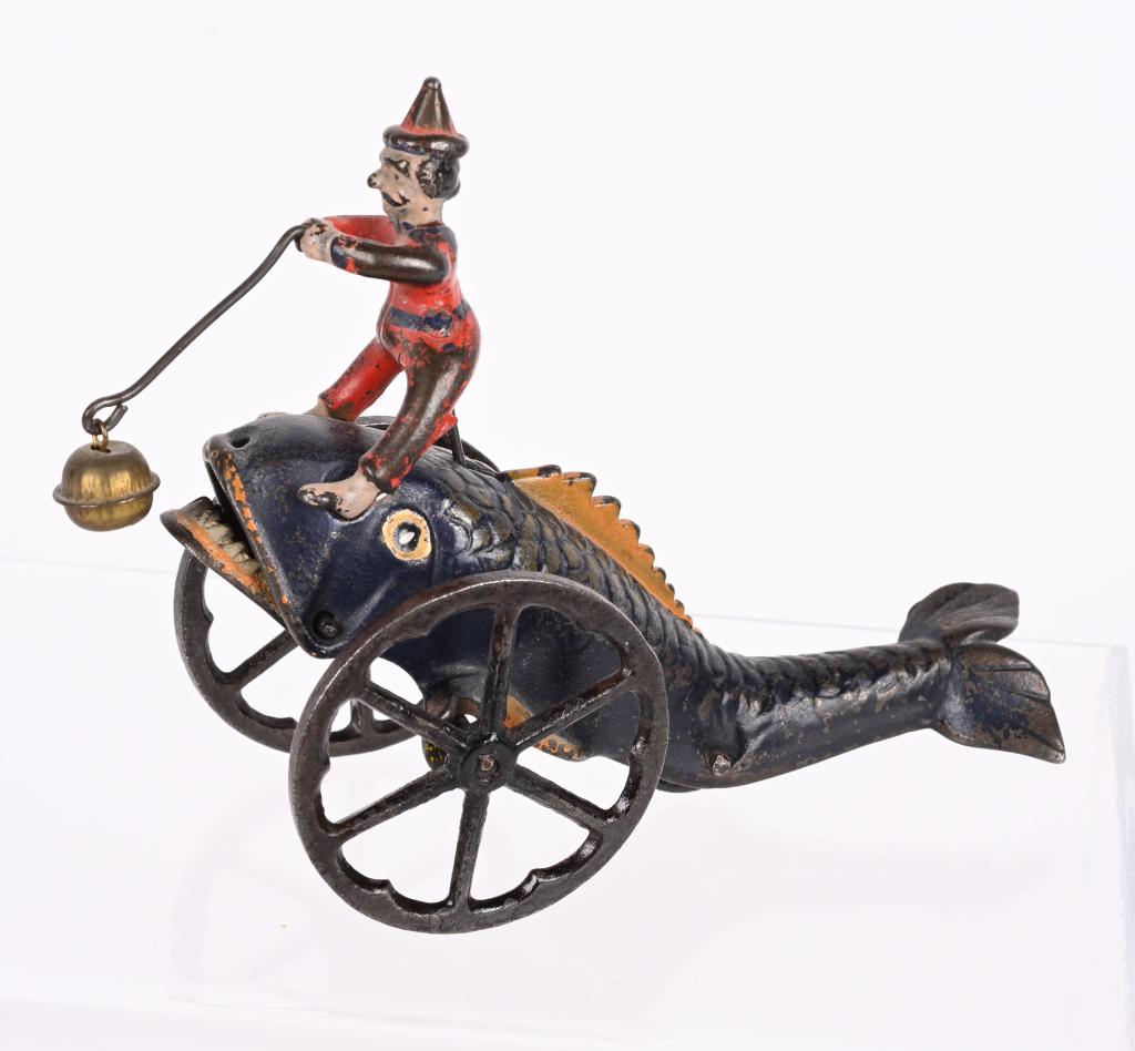 N.N. HILL CAST IRON CLOWN ON FISH BELL TOY (1 of 5)
