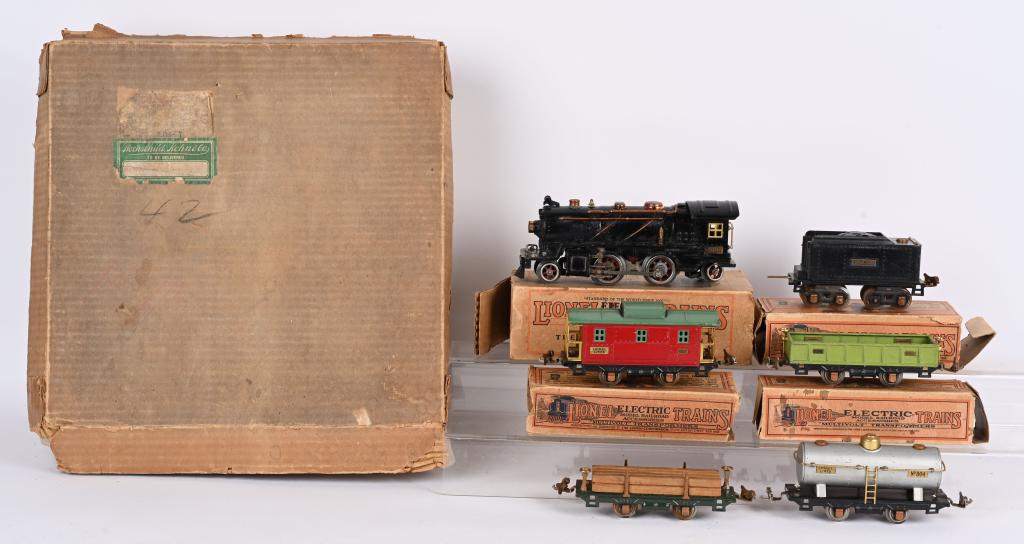 LIONEL PREWAR O GA 262 LOCO & TENDER w/ CARS: Includes 262 Locomotive with some corrosion, 262T Tender, 902 Gondola, 831 Lumber Car, 804 Tank Car, and 807 Caboose. Comes with some individual boxes, track, and Hochschild & Kohn Co Box
