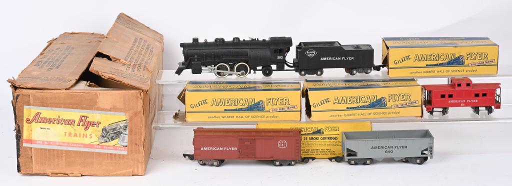 AMERICAN FLYER 302 LOCOMOTIVE, TENDER & CARS BOX: American Flyer set includes 302 Locomotive and tender 640 Hopper car, 642 Box car and 638 Caboose. Includes transformer, track and set box. Very Good-Excellent