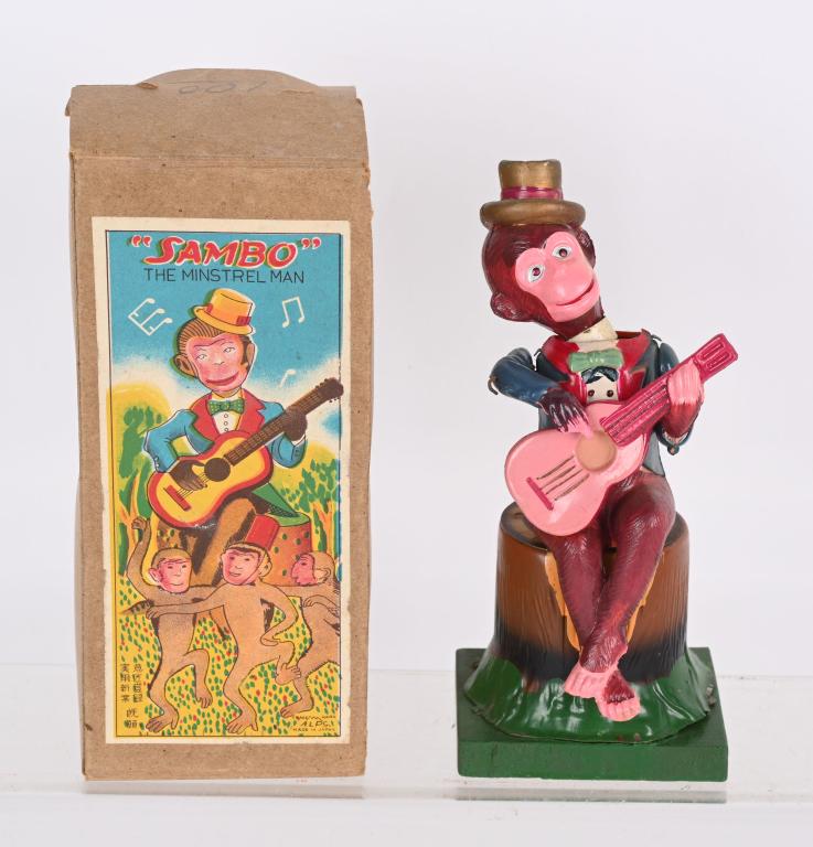 JAPAN WINDUP SAMBO MONKEY PLAYING GUITAR w/ BOX: Japan celluloid windup Monkey Playing Guitar. All original with great colors. Windup works. Comes with Box. Excellent