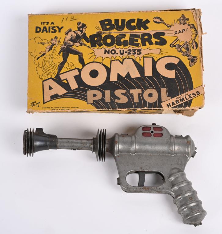 DAISY BUCK ROGERS AUTOMIC PISTOL w/ BOX: Original Daisy Buck Rogers Atomic pistol with original box. Pistol works, has wear and surface rust, Original box has wear and missing end flaps. 9 1/2", Good-Very Good